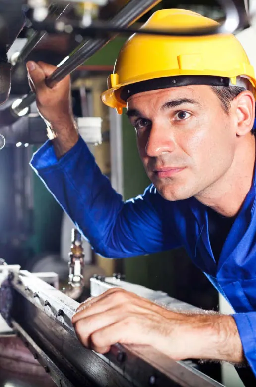 Inspection technician performing non-destructive testing
